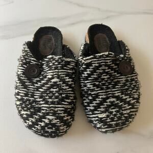 Black and white knit slip-on clogs with a bohemian vibe Muk Luks